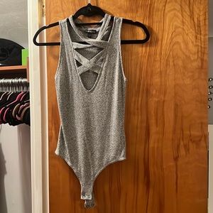 Grey criss cross front body suit from Express